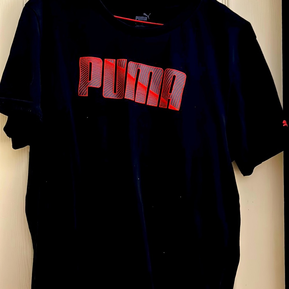 Puma black t-shirt with red logo and small red puma logo on left sleeve.